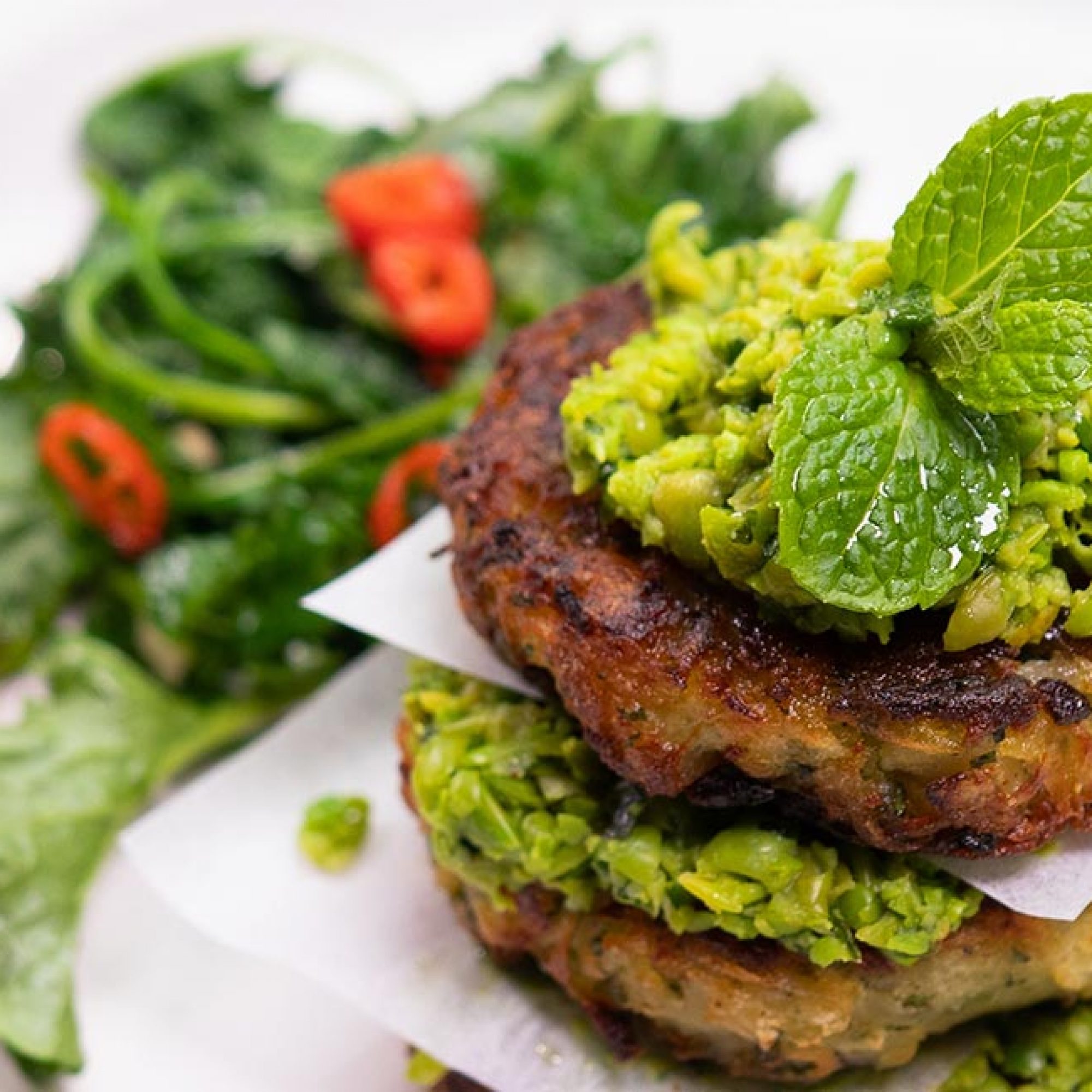 Hoki Hash Fritters with Chilli Herb Smashed Peas and Greens Recipe