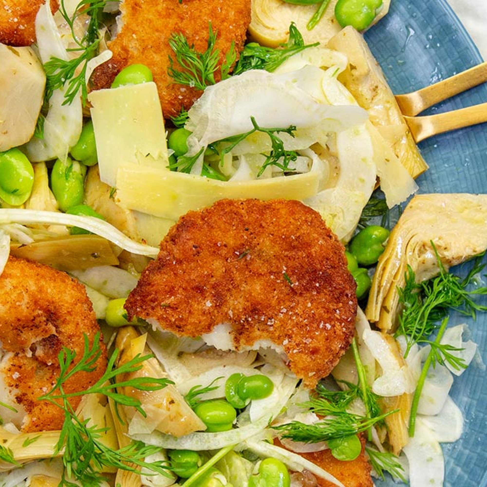 Crab Cakes with fennel, artichoke and broad bean salad